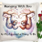 Two Sloths Hanging from a Tree in Love